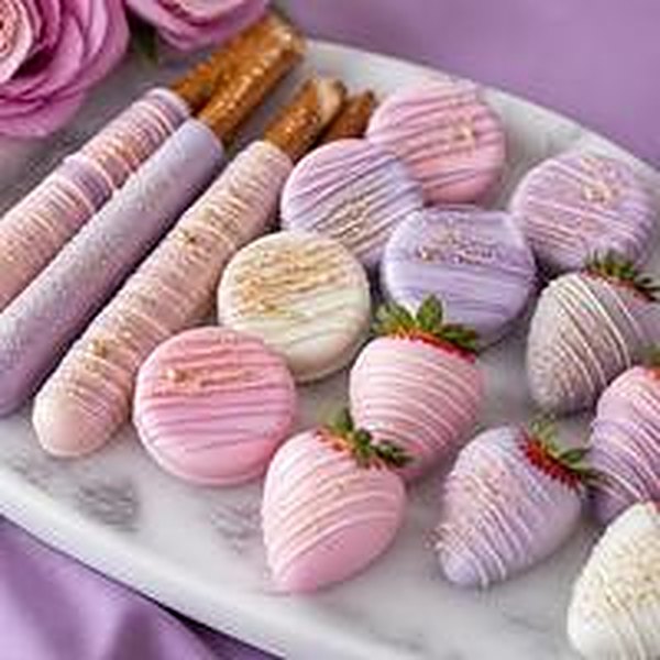 Dipped pretzels, cookies and strawberries